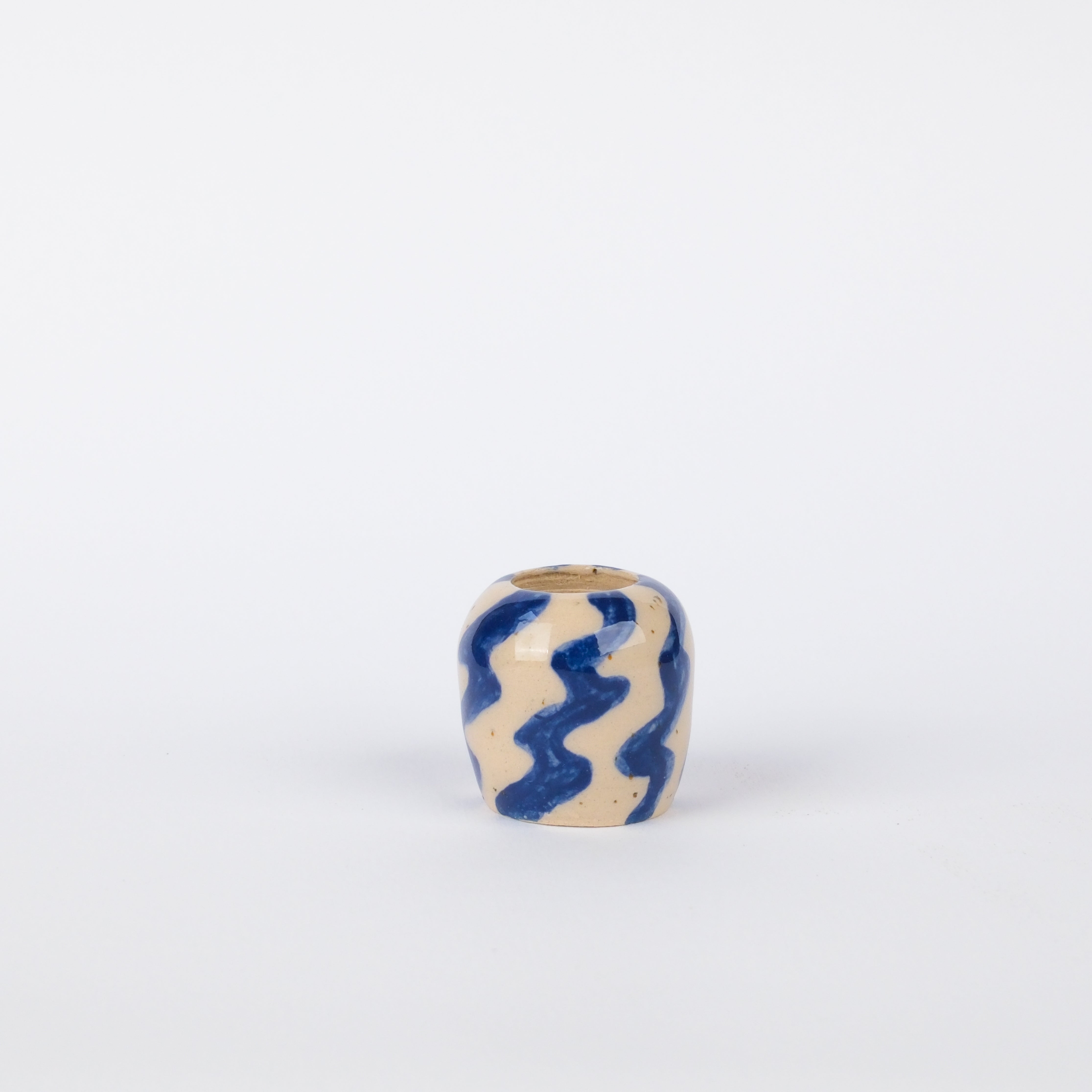 Hand-painted 30mm stoneware vase with blue zig-zag patterns on a speckled cream background.